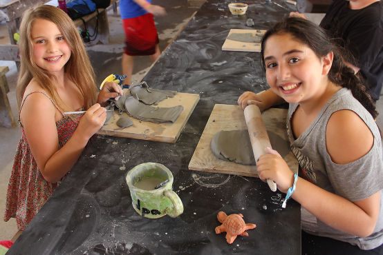 Campers doing Ceramics in the Art Department